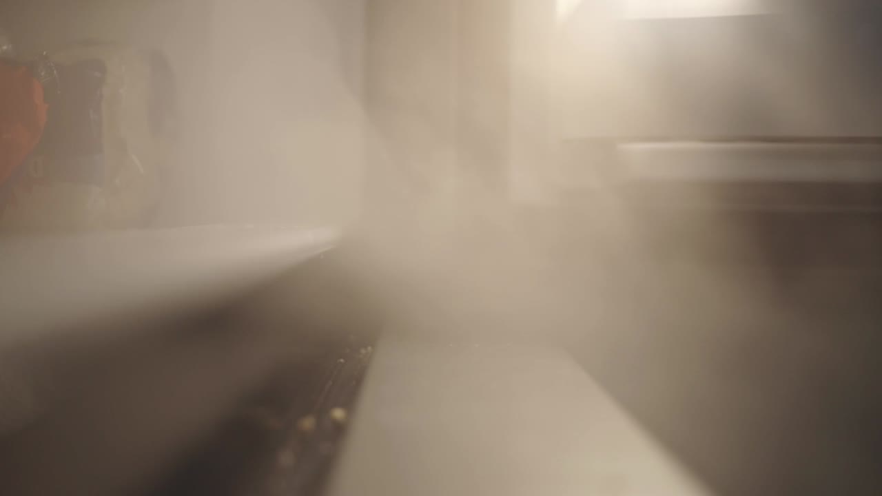 Cold Steaming Water Vapor Coming Out From The Freezer - Closeup Shot