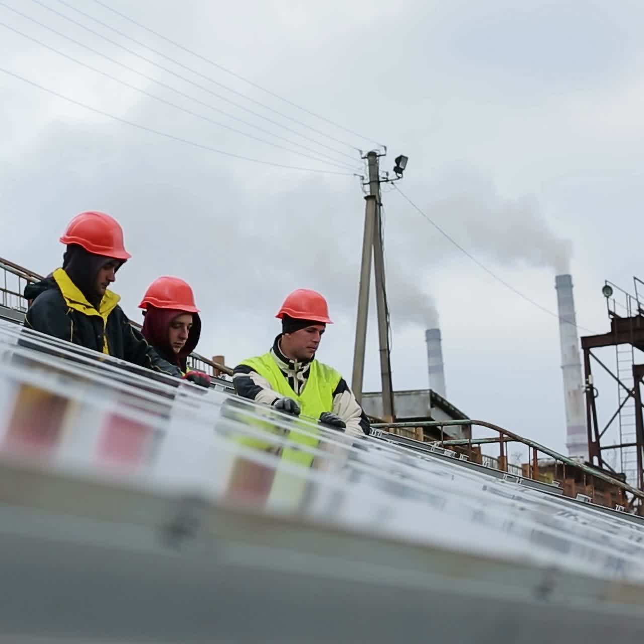 Worker install solar panels