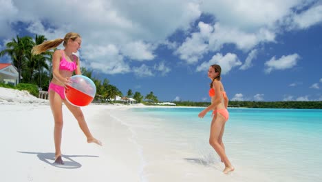 female caucasian children in swimwear enjoying tropical vacation