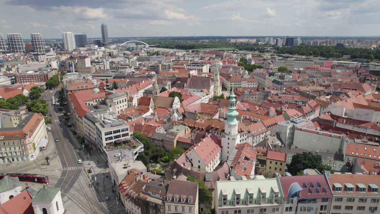 Bratislava's old town with red roofs and michael's tower under a cloudy sky, aerial view
