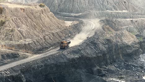 large mining dump trucks, also known as haul truck going into the coal mine in india