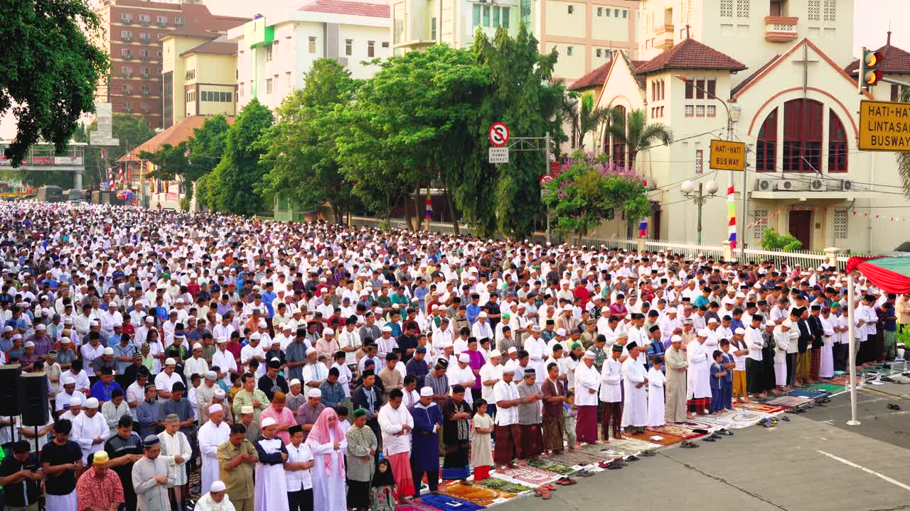 Muslim people praying around the church