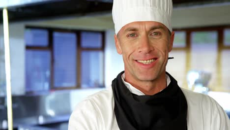 Portrait-of-happy-chef-standing-with-arms-crossed