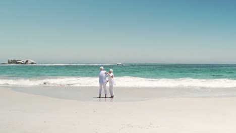 old retired couple dancing together