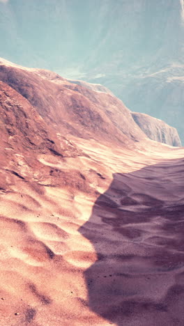 arid desert landscape with sand dunes and mountains