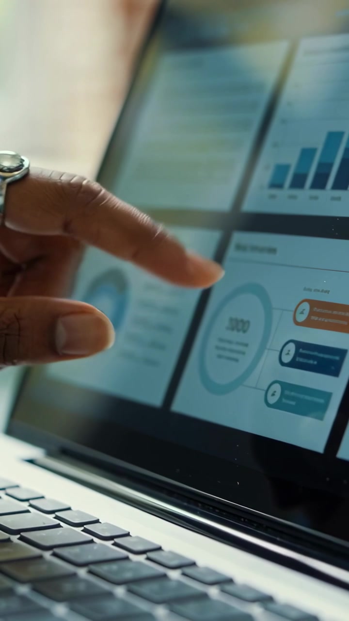 Data analyst hand hovering tapping touchscreen laptop dashboard updating live chart for data review