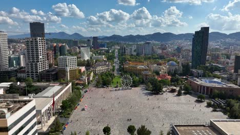 flyover prominent public plaza of skanderbeg square in tirana, albania. aerial drone shot