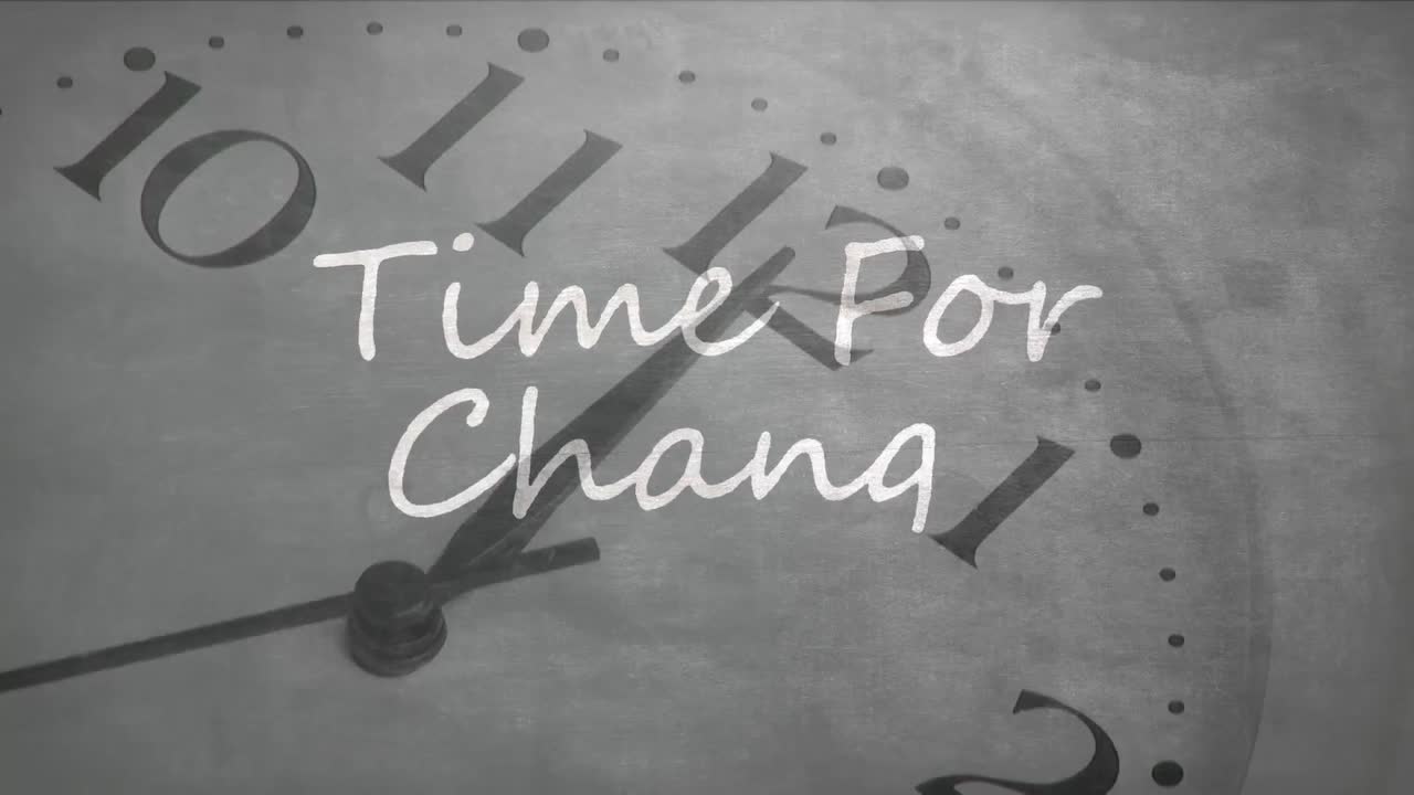Animation of the words Time For Change written over clock moving  in the background