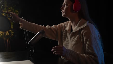 woman recording a podcast or stream