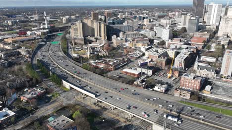 Aerial-timelapse-of-Atlanta-highway-traffic-and-overpass,-Georgia,-USA