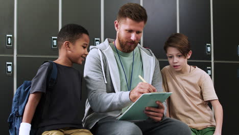 Man-and-children-at-the-locker-room