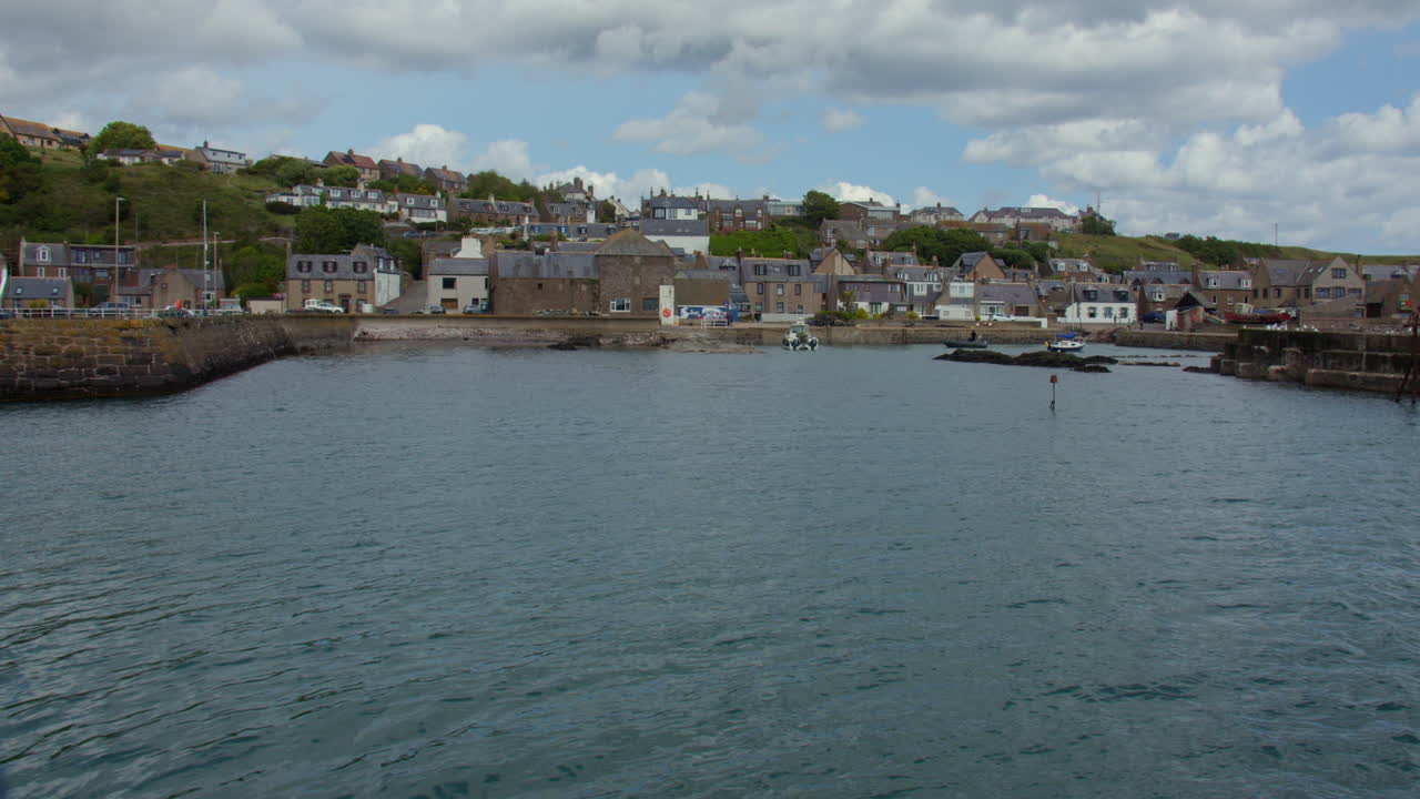 Wide shot looking at the village of Gourdon and Harbour from the pier