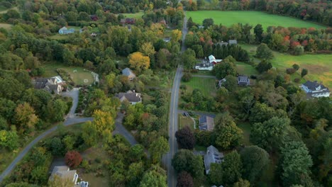 aerial dolly along road connecting homes in a quiet rural neighborhood, amherst massachusetts