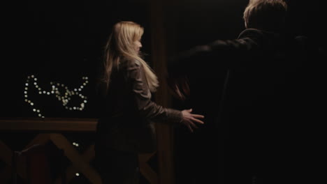 couple arguing in a dark room
