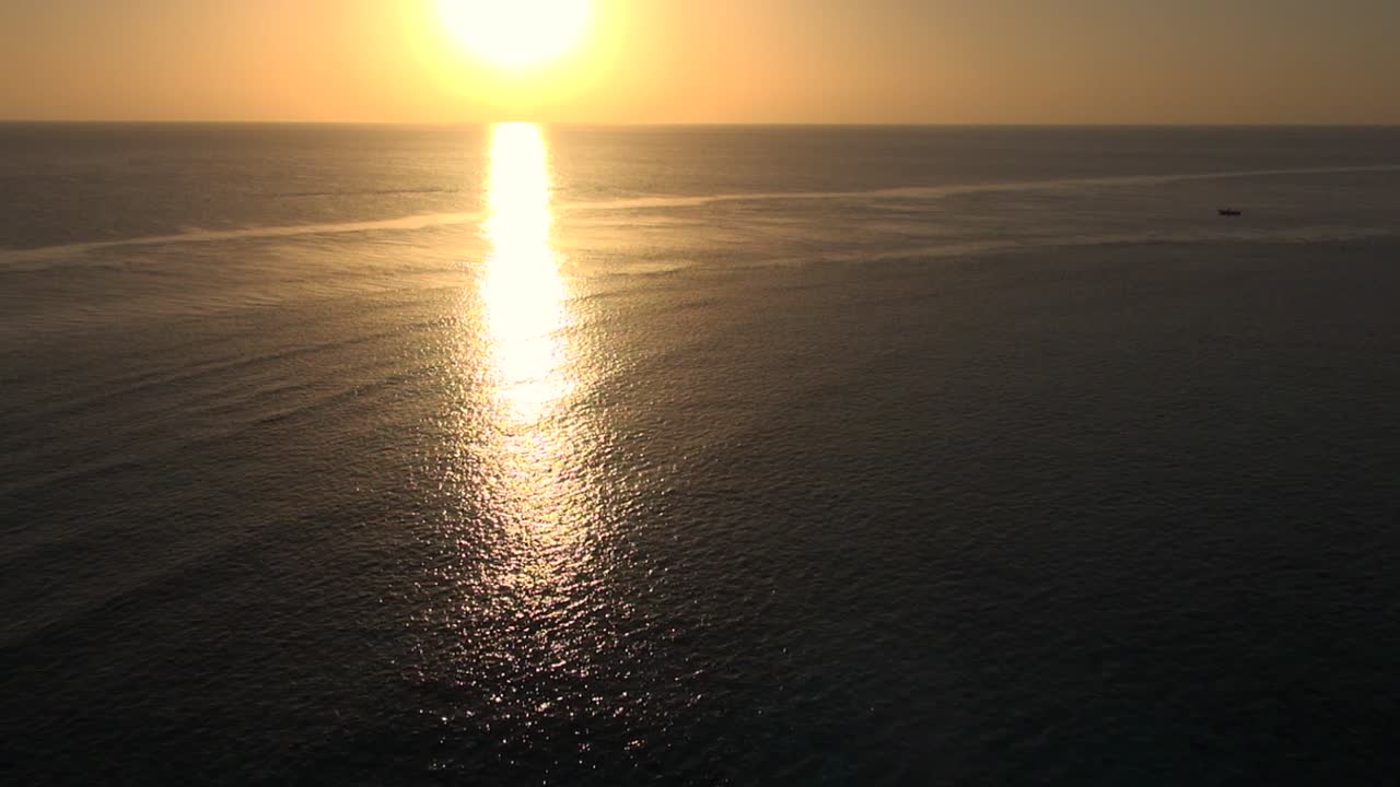 High angle golden sunset at Red Sea Daedalus Reef Lighthouse, Egypt