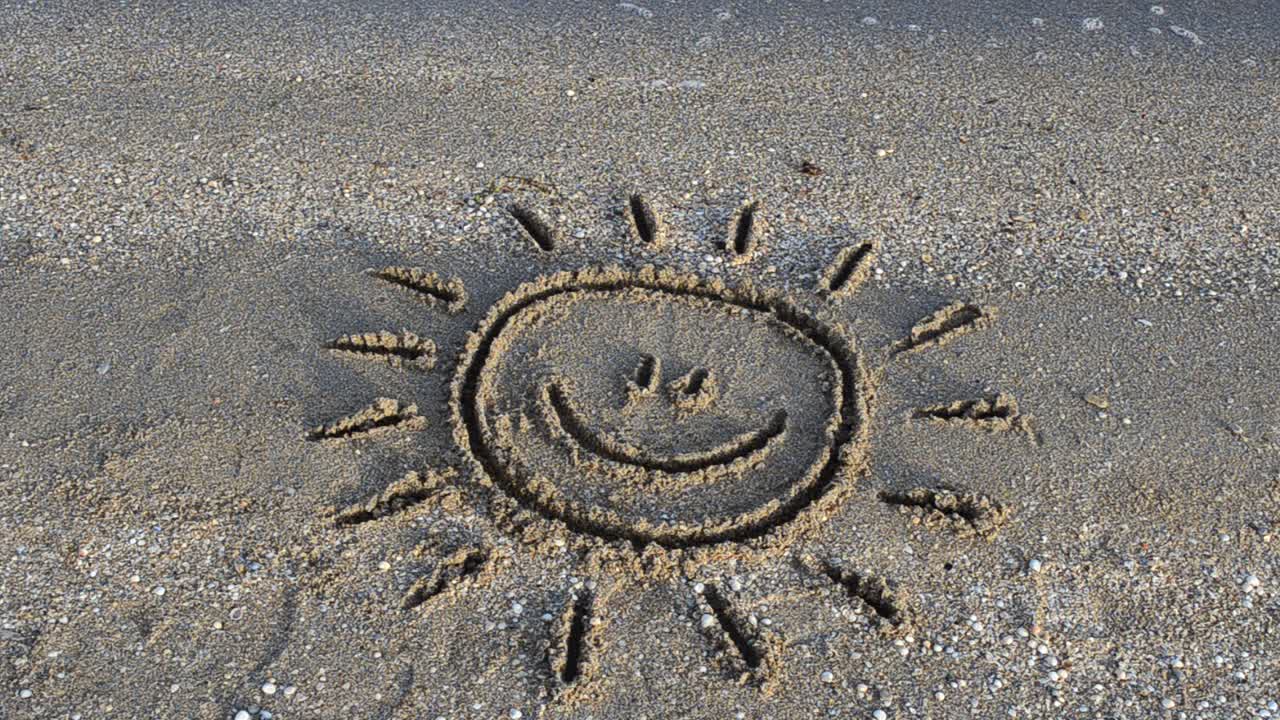 Sun drawing on the beach. Beach and drawing
