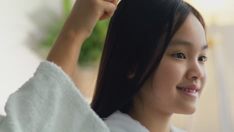 girl getting her hair brushed