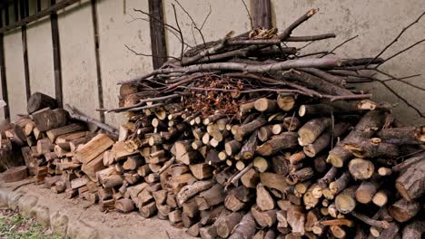 stacked firewood in a backyard of old Japanese house
