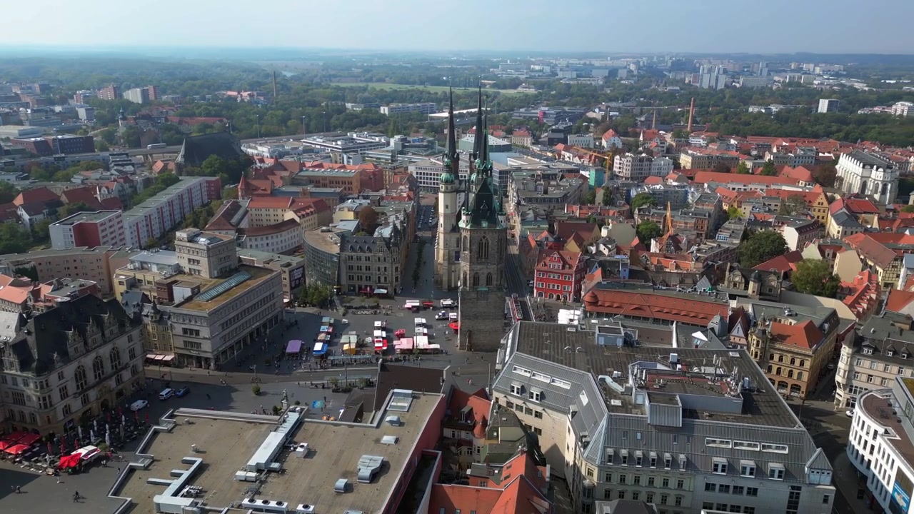 market square with the red tower and st. Mary's church in halle saale, germany. Amazing aerial view flight wide orbit overview drone