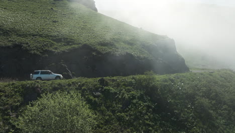 Misty-Sky-Against-Tskhratskaro-Pass-With-Driving-Car-In-Ktsia-Tabatskuri-Managed-Reserve-In-Georgia