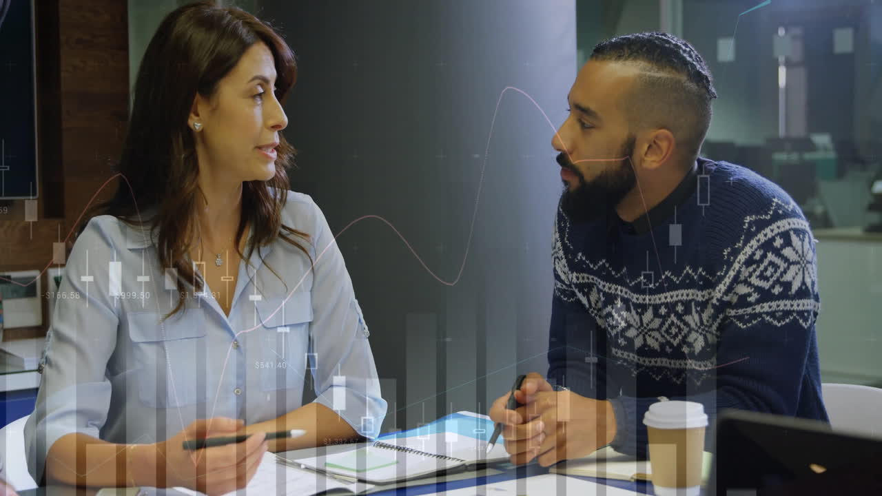 animación de gráficos de datos financieros durante una reunión de negocios entre dos colegas