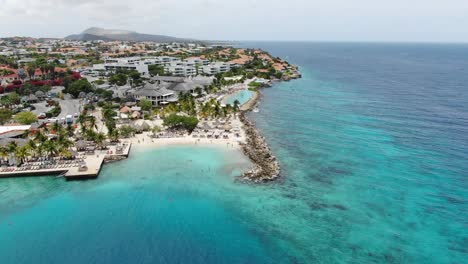 Jan-thiel-beach-in-curacao-with-clear-turquoise-water,-aerial-view