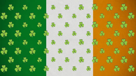 animación digital de varias hojas de trébol que se mueven contra la bandera irlandesa