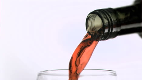 Bottle-of-red-wine-in-super-slow-motion-filling-a-glass