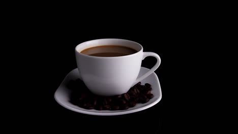 white coffee cup with coffee beans