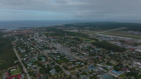 Aerial-panoramic-footage-of-residential-Walmer-borough-near-international-airport.-Sea-surface-in-background.-Port-Elisabeth,-South-Africa