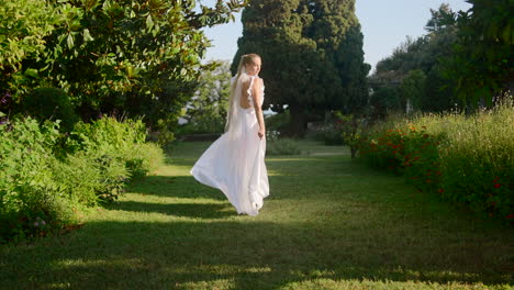 woman in a white dress in a garden