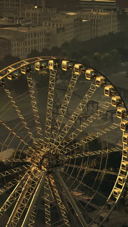 a ferris wheel in a city at sunset