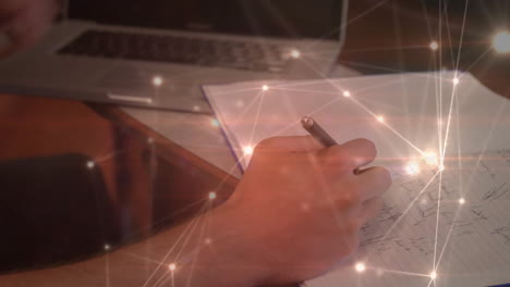 Writing-notes-on-paper,-person-surrounded-by-glowing-network-connections-animation