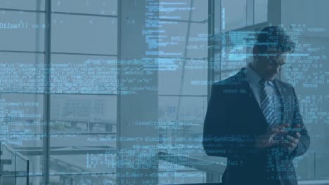 data processing against caucasian businessman using smartphone at office