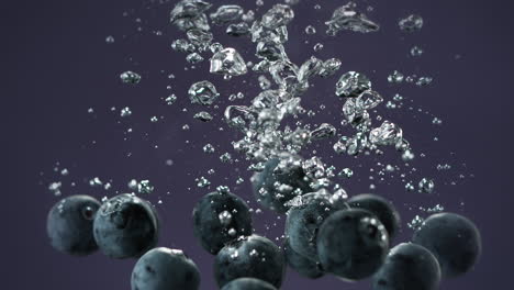 blueberries dropped into water making bubbles and sinking on purple background, slow motion and macro