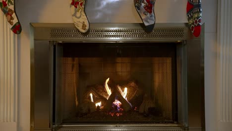 cozy warm fireplace with hanging christmas socks above