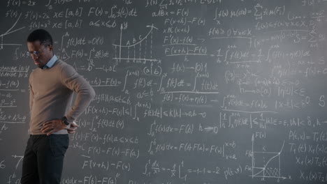 man explaining math on a chalkboard