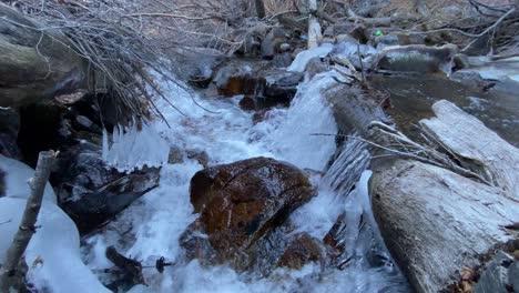 Small-waterfall-creek-river-coming-from-the-mountains,-clear-water-at-big-pine-lakes-california