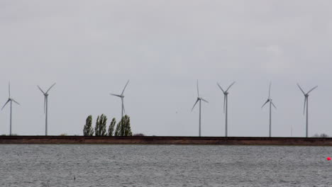 wide shot at wind turbines moving in the wind at covenham reservoir covenham at st bartholomew, louth