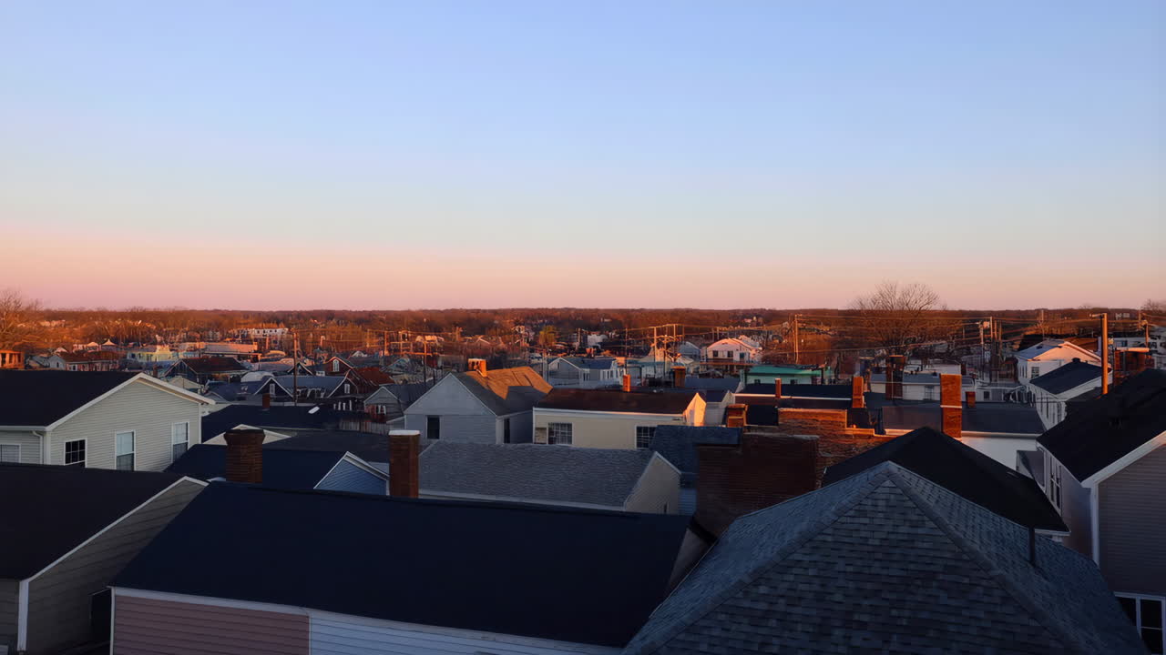 Rooftop View of a Residential Area at Sunset