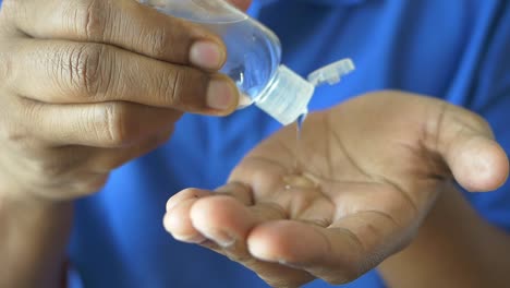 person applying hand sanitizer