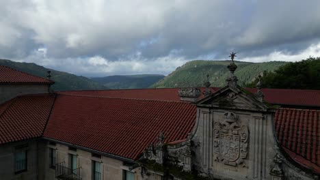 aerial footage of santo estevo monastery, its buildings and the sil canyon