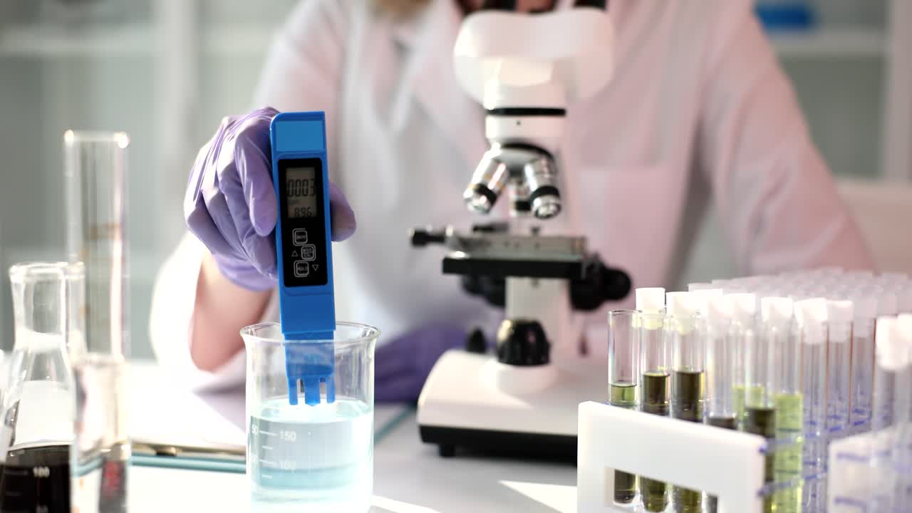 Laboratory Experiment with pH Meter and Microscope