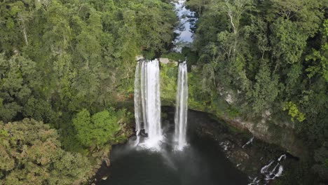 excellent aerial shot of a waterfall in the chiapas rainforest of mexico