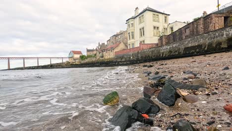 waves gently lap against the rocky shore