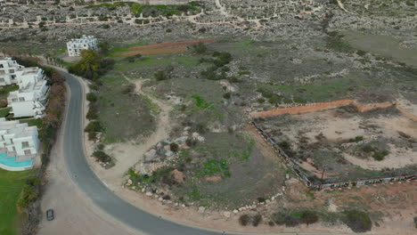 Aerial-tilt-up-shot-of-scenic-landscape-with-hotels-in-Ayia-Napa,-Cyprus