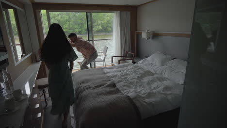 Tourist-Couple-On-Cruise-At-Cabin-With-Stunning-View-Of-Danube-River-In-Daytime