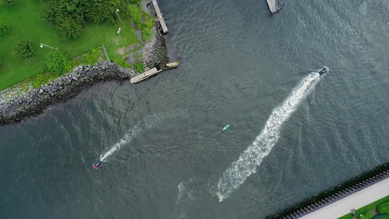 Bird's Eye View of Woman Kayaking in the Hudson River Surrounded by Jet Skis