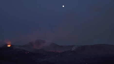 small plane flying over full moon above volcanic eruption iceland