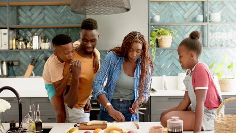 preparing lunch, happy family enjoying time together in modern kitchen
